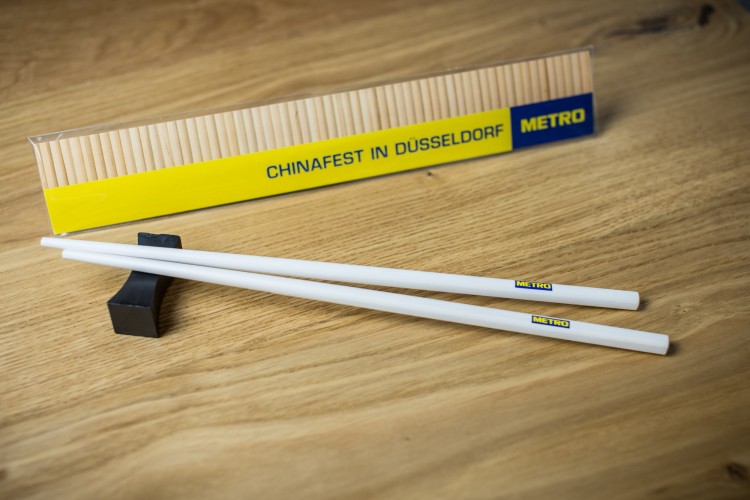 white chopsticks with logo for METRO